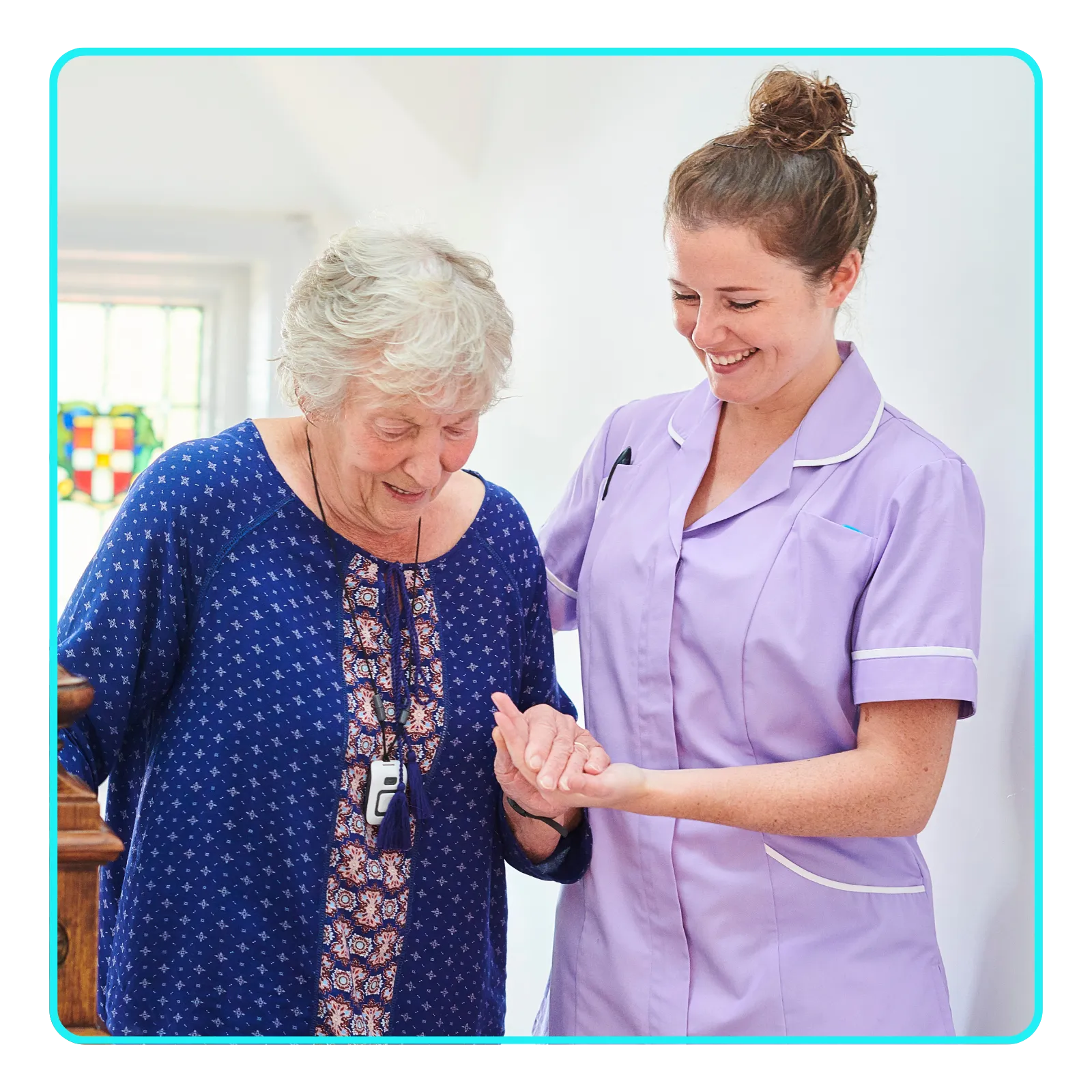 Caregiver helping elderly woman walk, both smiling