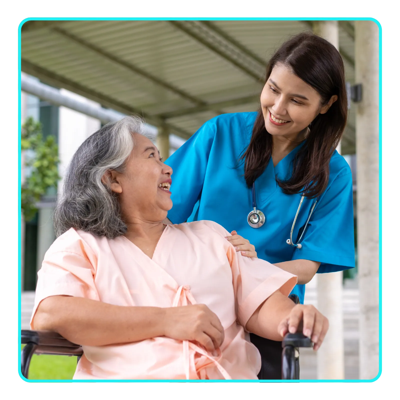 Nurse assisting elderly woman in wheelchair