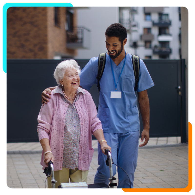 Caregiver walking with elderly woman using walker