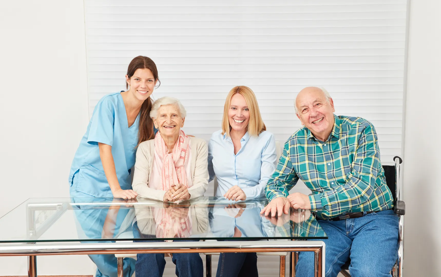 Happy seniors with caregiver and family