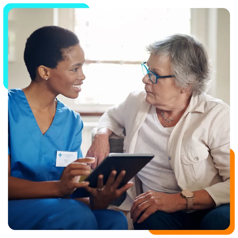 Nurse consulting senior woman with tablet